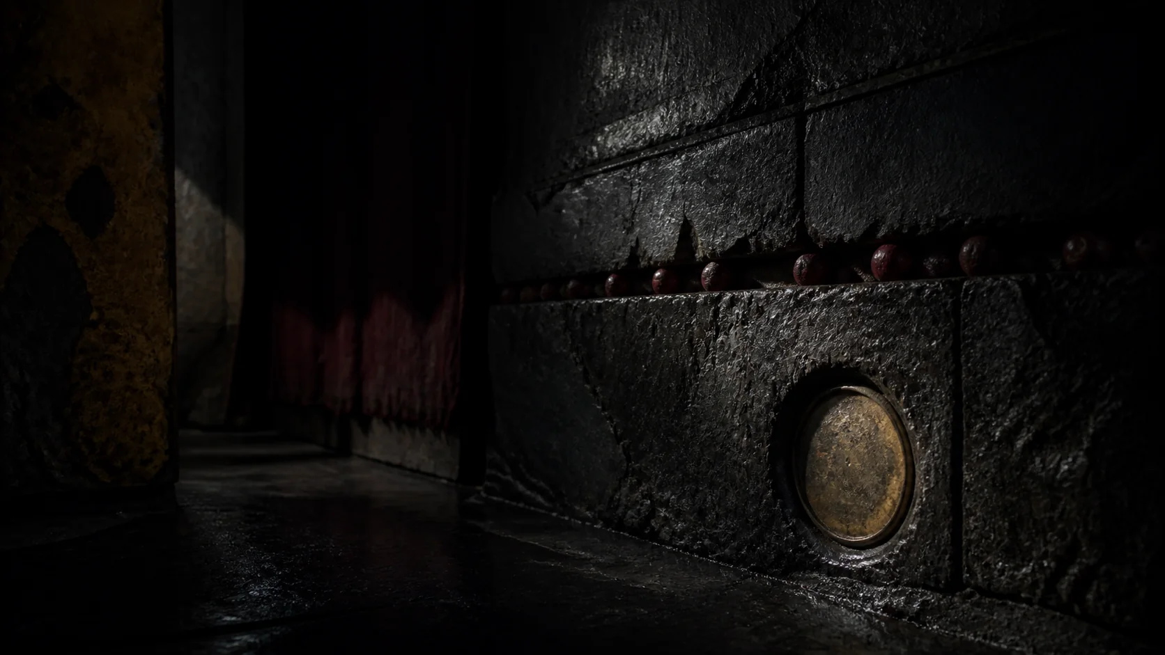 At midnight, only one side of the round metal surface is lit; curtain and stone recede into shadow.